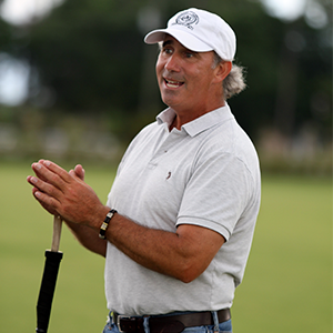 A professional golfer holding a club.
